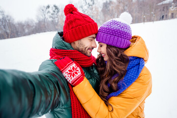 Profile side photo of young lovely couple happy positive smile hug cuddle romantic date snowy weather outdoors