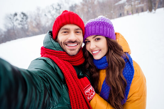 Photo of young cheerful couple happy positive smile hug shoot selfie picture holidays weekend outside