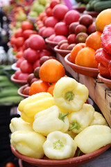 Fruits and vegetables selling on local farm market, eco, bio products. Bell pepper in the foreground. Shopping organic products. Healthy grocery