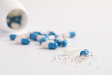 pills capsules with bottle isolated in white background