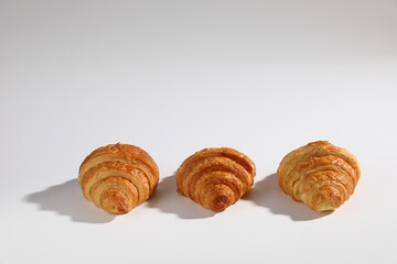 Croissant isolated in  wihite background with sunny light