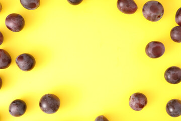 Red grapes isolated top view in yellow background