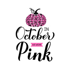 In October we wear pink lettering with pumpkin. Breast cancer awareness month quote. Vector template for typography poster, banner, flyer, sticker, etc