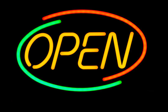 Neon glowing open store sign