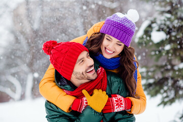 Photo of charming shiny marriage couple wear windbreakers embracing looking eyes to eyes walking snowy weather smiling outside park