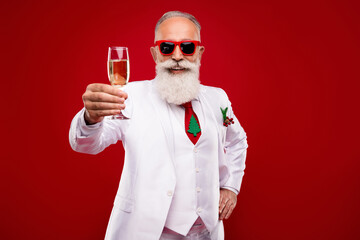Photo of happy cheerful old man hold hands champagne glass make toast entertainer isolated on red color background - obrazy, fototapety, plakaty