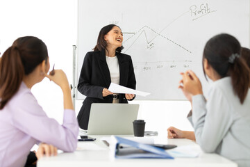 Fototapeta premium young businesswoman seminar or meeting and presentation about work project on whiteboard