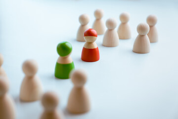 Red and green wooden figures teams against opponent or enemy. Strategy, Conflict, management, business planning, tactic, politic, communication and leader concept
