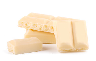 Lots slices of white chocolate isolated on white background close up