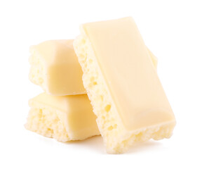 Lots slices of white chocolate isolated on white background close up