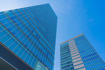 Fototapeta na wymiar Akihabara, Tokyo, Japan. Modern skyscrapers in the business district against a blue sky.