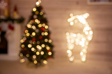 christmas background greeting card blurred christmas tree and deer figure from garland