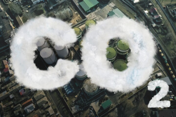 Inscription CO2 made of smoke. Aerial view of industrial factory