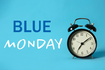 Alarm clock and text Blue Monday on color background