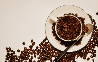 Coffee background with beans and white cup. making coffee in pub, bar, restaurant. Top view.