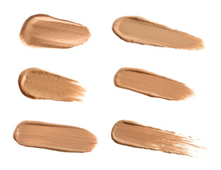 Set with different shades of liquid skin foundation on white background, top view
