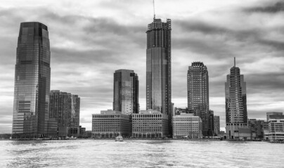 Fototapeta premium Downtown New York City at sunset from a moving ferry boat.