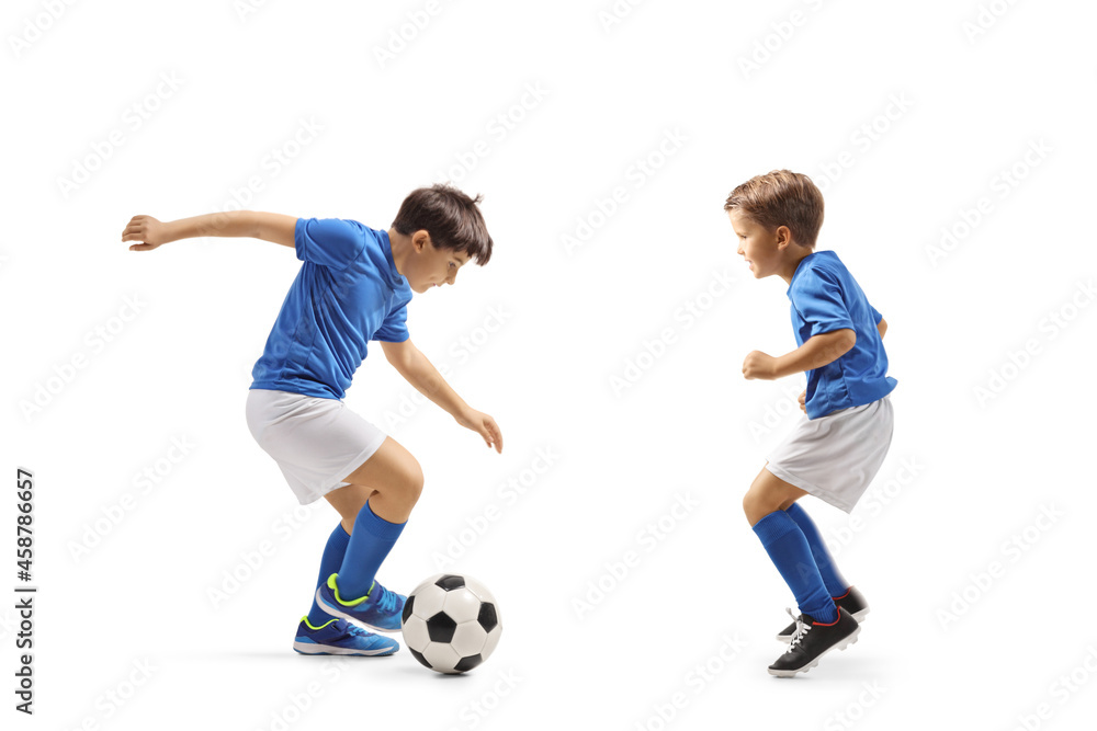 Poster Two boys in football jersey playing with a ball