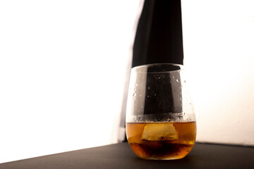 Glass of wiskey on white background.