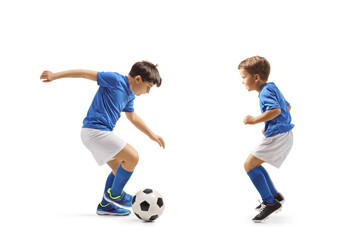 Two boys in football jersey playing with a ball