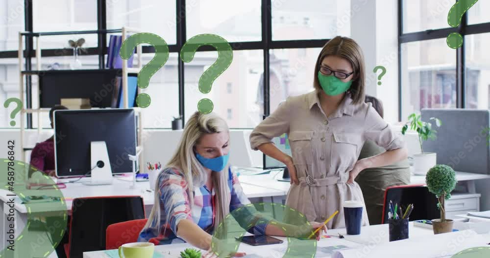 Poster animation of question marks over diverse businesswomen wearing face masks and using computer