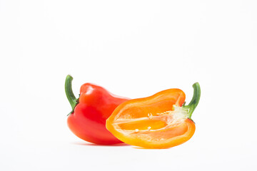 Red bell pepper isolated on a white background. Paprika, cut in half