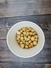 The Fresh hot natural popcorn close-up. Fresh caramel corn.
