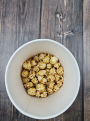 The Fresh hot natural popcorn close-up. Fresh caramel corn.