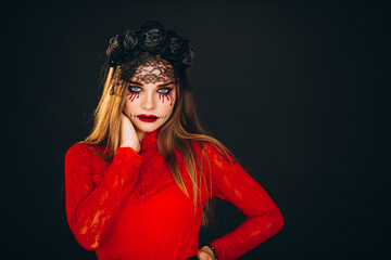 Woman in a halloween costume in studio