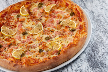 fresh pizza on the white plate