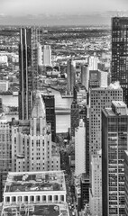 Fototapeta na wymiar Modern skyscrapers of Midtown Manhattan in winter season, aerial view from a rooftop.