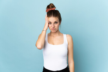 Young caucasian woman isolated on blue background with an expression of frustration and not...