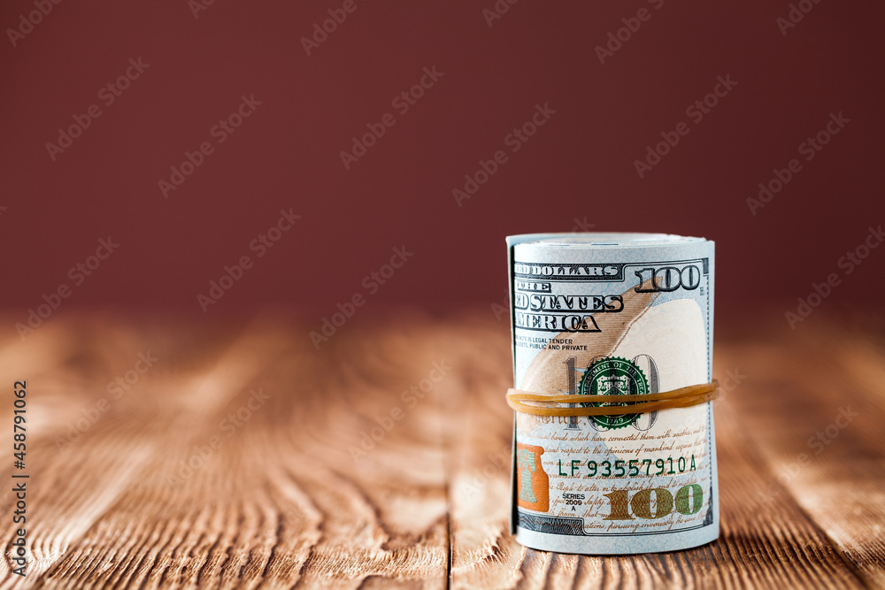 Wall mural American dollars on the wood table