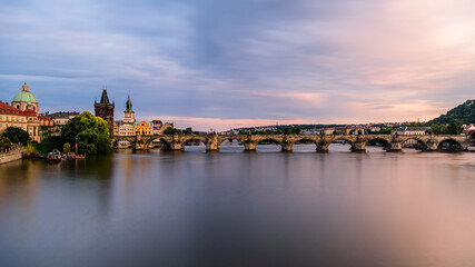 Famous Charles bridge in Prague during twilight.  