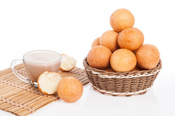 Buñuelos traditional Colombian food; Fried Cheese Bread And Hot Chocolate Drink, Photo On White Background