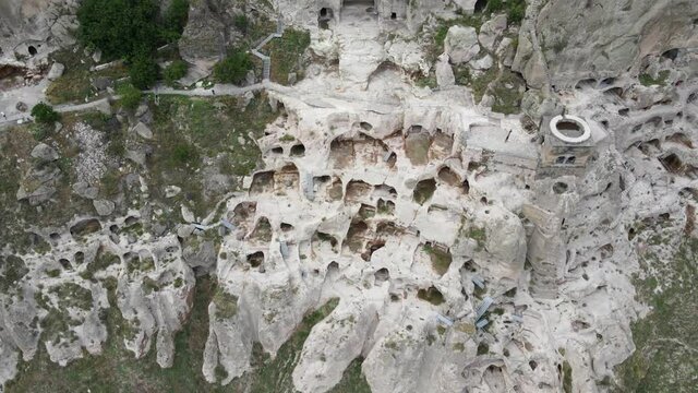 Aerial panoramic drone view of Vardzia ancient caves monastery in the Erusheti Mountain at Kura River in Georgia