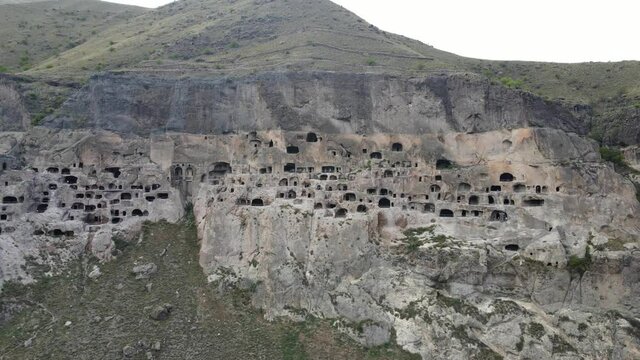 Aerial panoramic drone view of Vardzia ancient caves monastery in the Erusheti Mountain at Kura River in Georgia