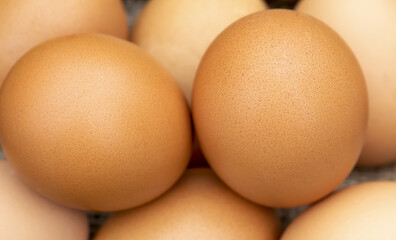 Organic brown chicken eggs close-up background, healthy breakfast raw food