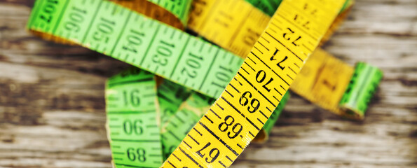 Web banner of a retro colorful tape measure. Weight loss concept.