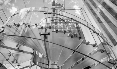 Silhouette people on glass staircase, view from the bottom.Business concept