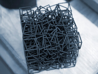 Object printed on industrial powder 3D printer close-up.