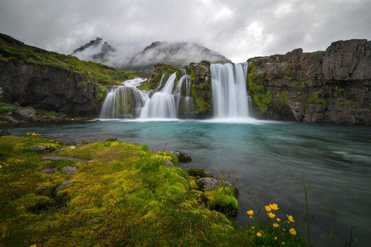 Waterfall in iceland with clouds © quickshooting