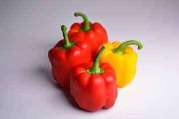 Fresh juicy bell peppers on a gray background, copy space. Fresh vegetables sweet Red and Yellow Peppers.