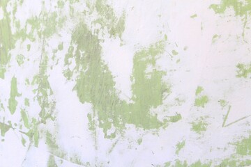 green wall background with white texture spots