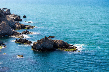 High angle view of scenic view of cliffs along the coast.