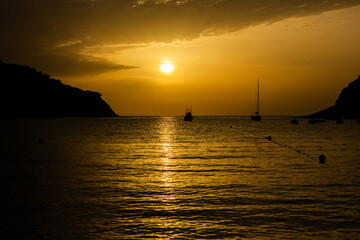 Fototapeta na wymiar Amazing landscape picture with red colored sunset in Ibiza, Spain.