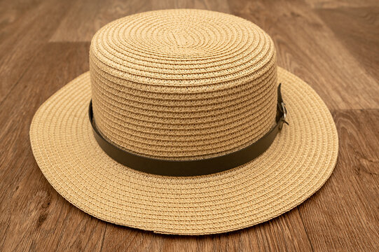 The straw hat is on the floor. Headdress for women and men.