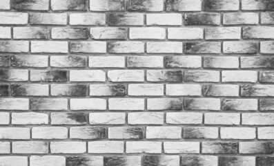 Simple hand made black and white brick. Detailed photo of brickwork, gray wall...