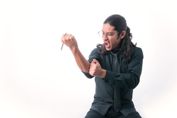 Person on white background. He is about to tear his shirt because he is angry and it looks like he is screaming. dressed in formal clothes. White space.