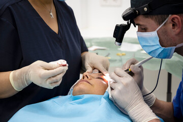 Plastic surgery operation, modifying the eye region in medical clinic